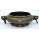 A small Chinese bronze censer 4 x 15 cm.