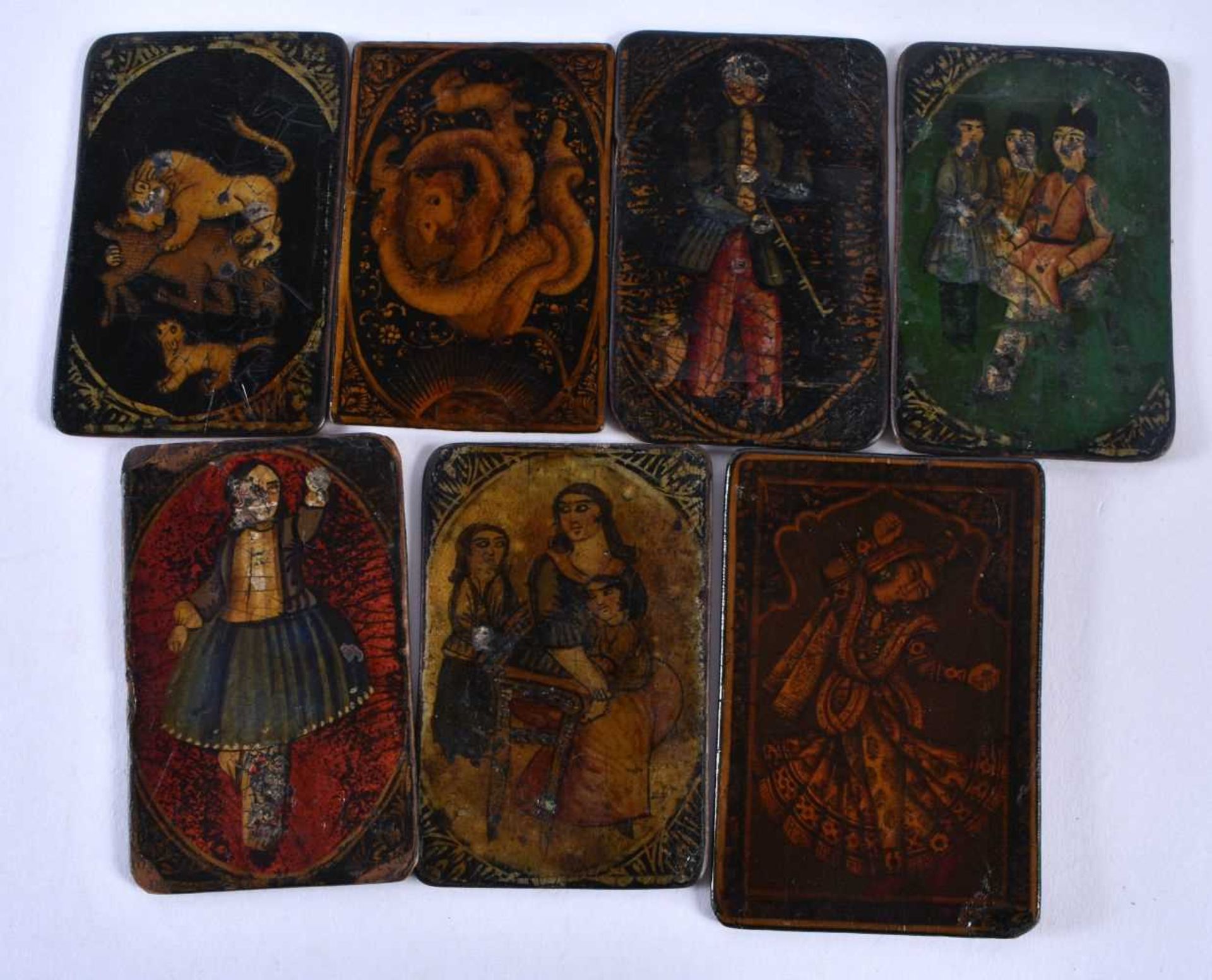 AN UNUSUAL SET OF SEVEN 19TH CENTURY PERSIAN IRANIAN QAJAR LACQUER PAINTINGS depicting figures and