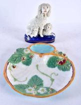 A 19TH CENTURY STAFFORDSHIRE FIGURE OF THREE POODLES together with a Majolica dish in the manner