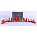 A RARE RED BAKELITE PART CHESS SET. Largest 6.5 cm high. (qty)