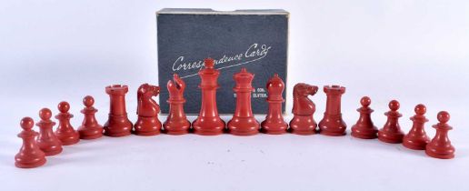 A RARE RED BAKELITE PART CHESS SET. Largest 6.5 cm high. (qty)