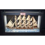 A glass cased model of a 19th Century 4 masted French sailing ship 35 x 60 x 15 cm