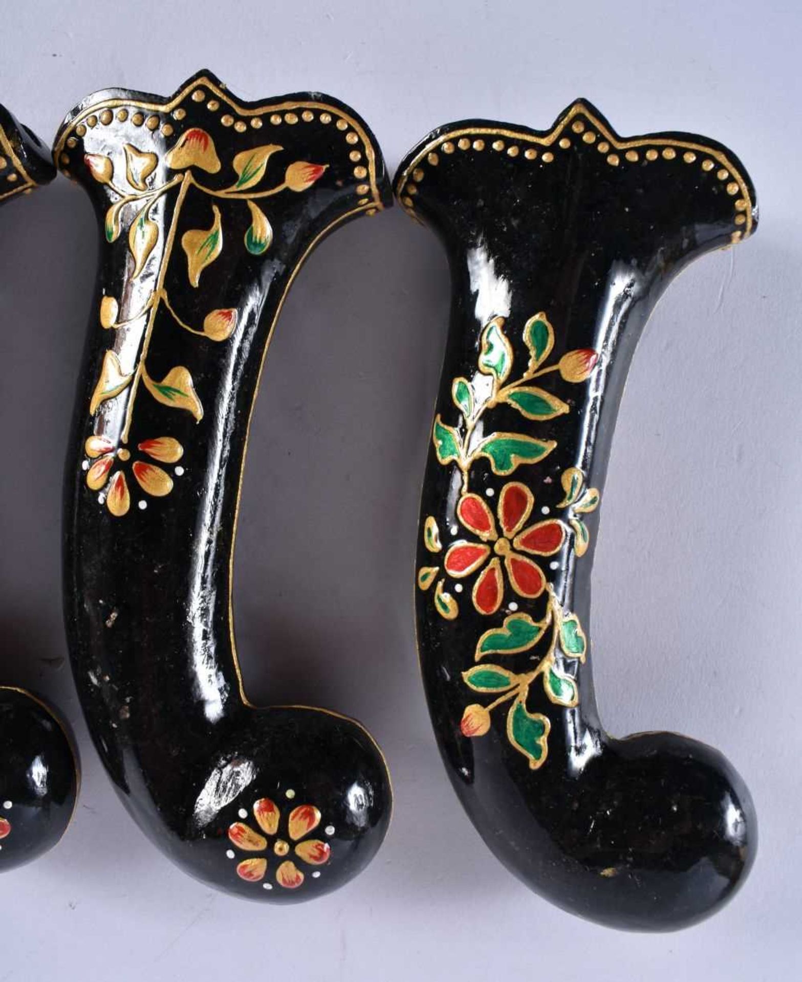 A SET OF FIVE MIDDLE EASTERN QAJAR LACQUER HARDSTONE DAGGER HANDLES overlaid with foliage and vines. - Image 2 of 6