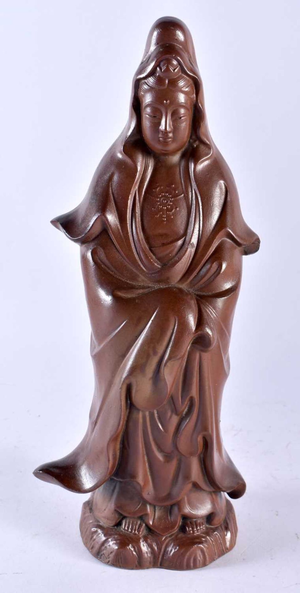 A 19TH CENTURY JAPANESE MEIJI PERIOD STONEWARE FIGURE modelled in robes. 29 cm high.