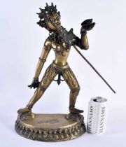 A LARGE 19TH CENTURY INDIAN TIBETAN BROZE FIGURE OF A STANDING BUDDHA modelled holding a sword. 42