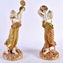 A PAIR OF 19TH CENTURY ROYAL WORCESTER BLUSH IVORY PORCELAIN FIGURAL MUSICIANS. 25 cm high.
