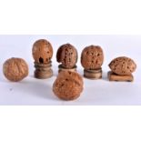 A COLLECTION OF 19TH/20TH CENTURY CHINESE CARVED NUTS Late Qing, in various forms and sizes. 5 cm