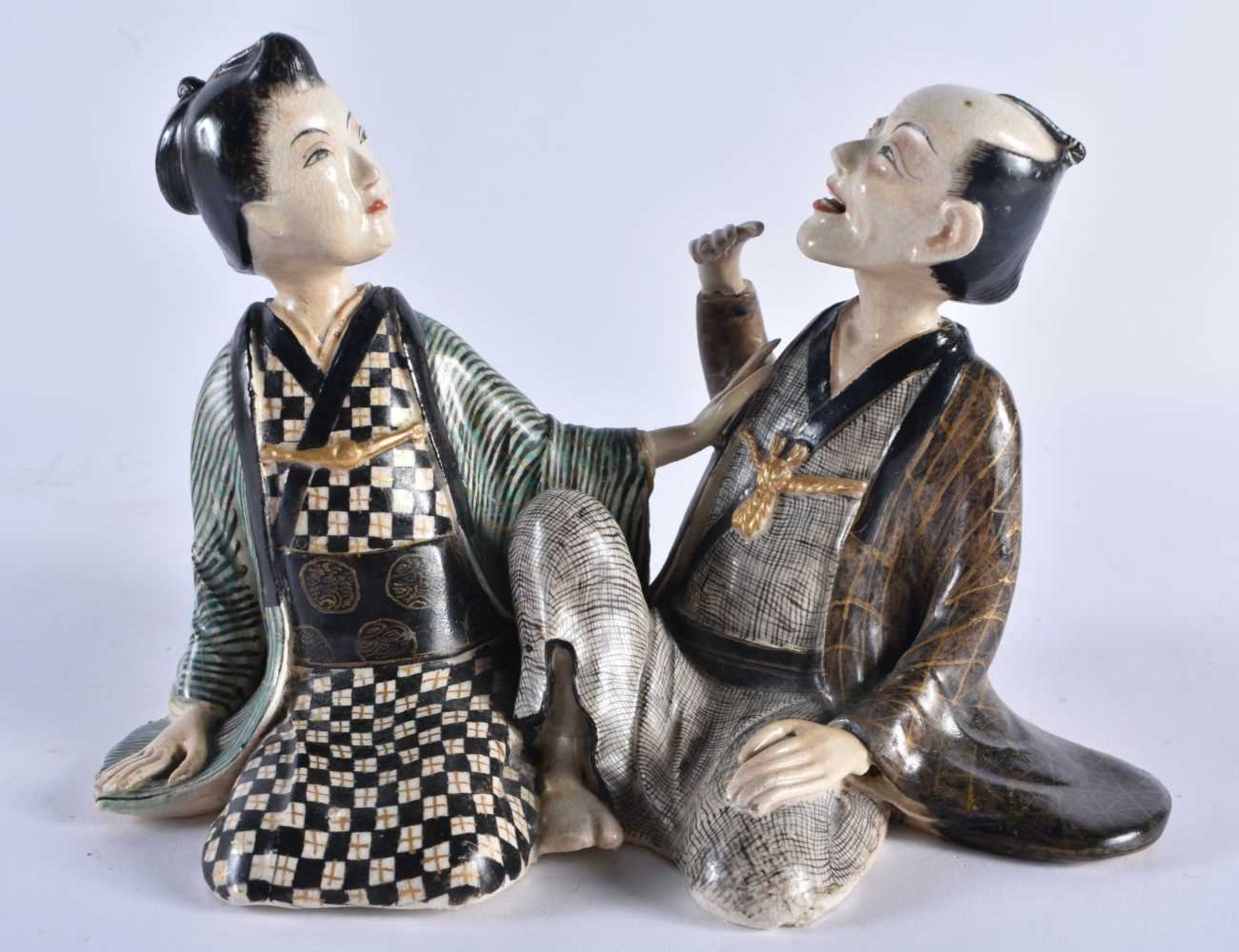 AN UNUSUAL 19TH CENTURY JAPANESE MEIJI PERIOD PORCELAIN FIGURE formed as a male and female. 15 cm