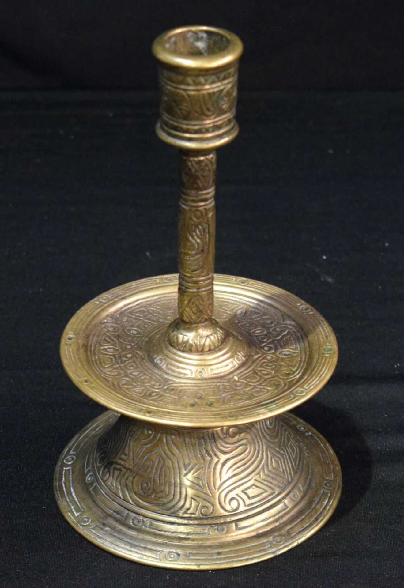 An Islamic brass candle stick holder 20 cm .