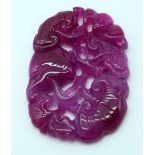 A Pink Tourmaline Carved Pendant. 6.4cm x 4.6cm x 0.7cm, weight 38g