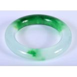 A Two Tone Green Jade Bangle. Internal Diameter 5.9cm. Weight 95.8g