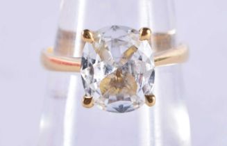 A 9 Ct Gold ring set with a White Sapphire. Size M, weight 3.56g