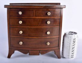 A LATE VICTORIAN MAHOGANY APPRENTICE CHEST OF DRAWERS with five imitation drawers, opening as one to