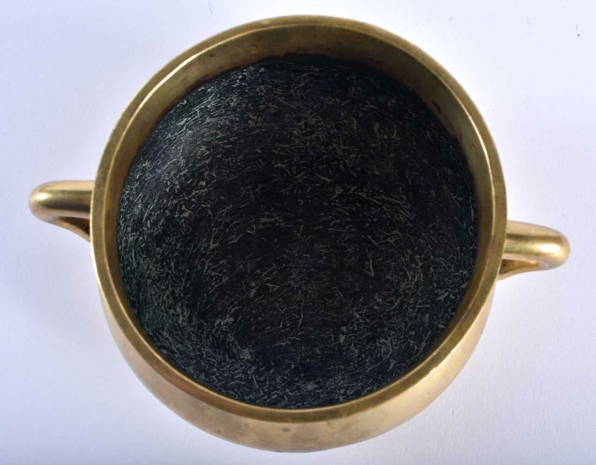 AN 18TH CENTURY CHINESE TWIN HANDLED BRONZE CENSER bearing Xuande marks to base, of plain form. - Image 7 of 16