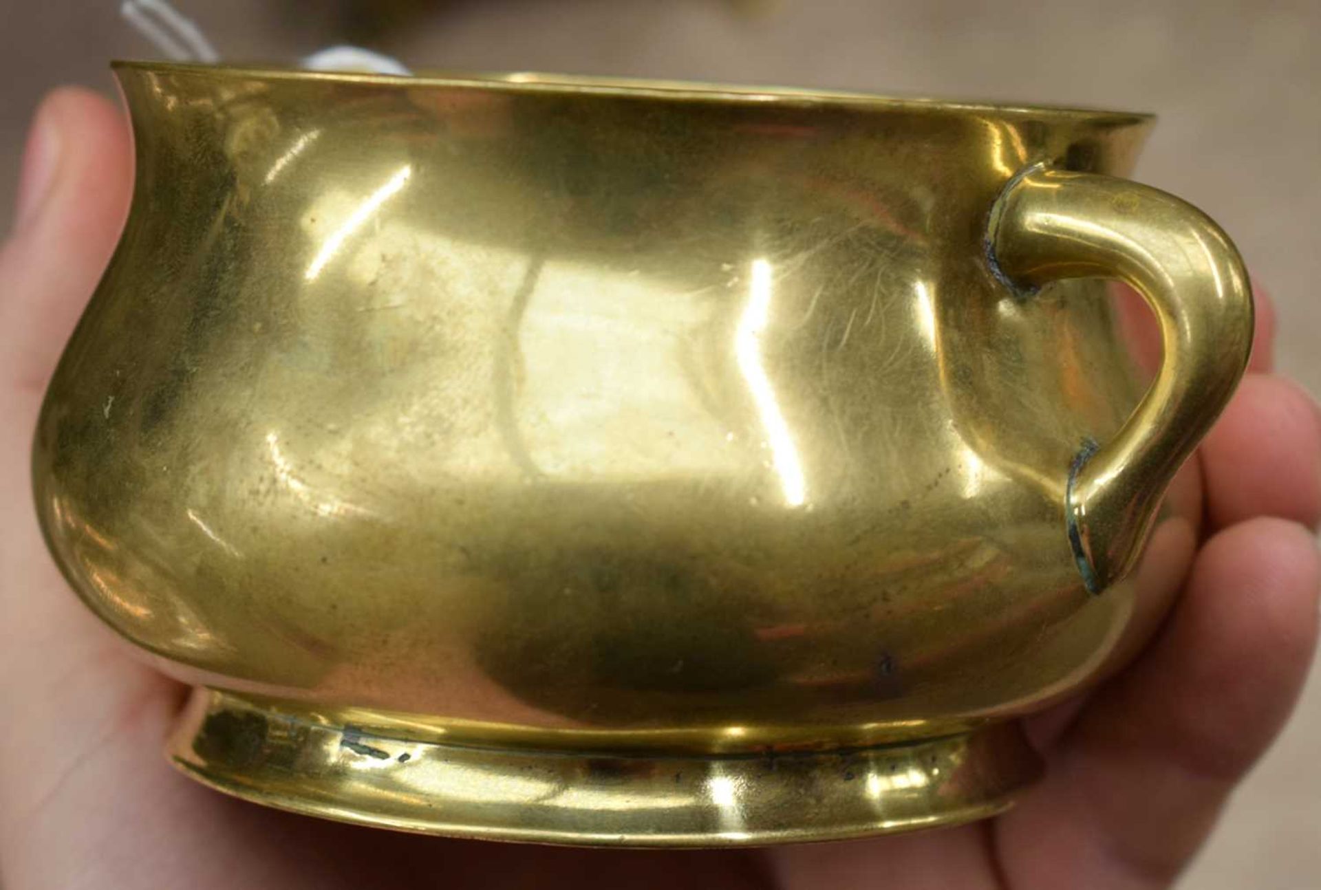 AN 18TH CENTURY CHINESE TWIN HANDLED BRONZE CENSER bearing Xuande marks to base, of plain form. - Image 10 of 16