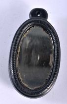 A RARE VICTORIAN IRISH CARVED BOX OAK EQUESTRIAN HAND MIRROR. 8.5 cm x 5.5 cm.