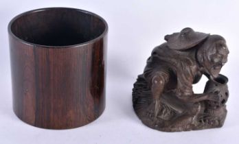 A CHINESE QING DYNASTY CARVED WOOD BRUSH POT together with a bamboo figure. Largest 11 cm high. (2)
