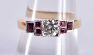AN 18CT GOLD DIAMOND AND RUBY RING the diamond approx 0.4 cts. P. 5.2 grams.