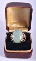 A Boxed 14ct Gold ring mounted with a Jade Cabochon. Size P