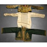 TWO 19TH CENTURY MIDDLE EASTERN TURKISH OTTOMAN SILK JACKETS with silk inner liner. 45 cm wide (