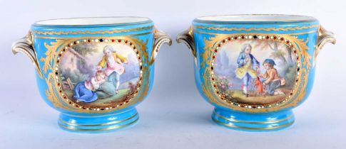 A PAIR OF 19TH CENTURY FRENCH SEVRES PORCELAIN CACHE POT painted with figures in landscapes, with