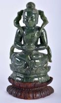 A 19TH CENTURY CHINESE CARVED JADE FIGURE OF A SEATED IMMORTAL Qing, modelled as a female with hands