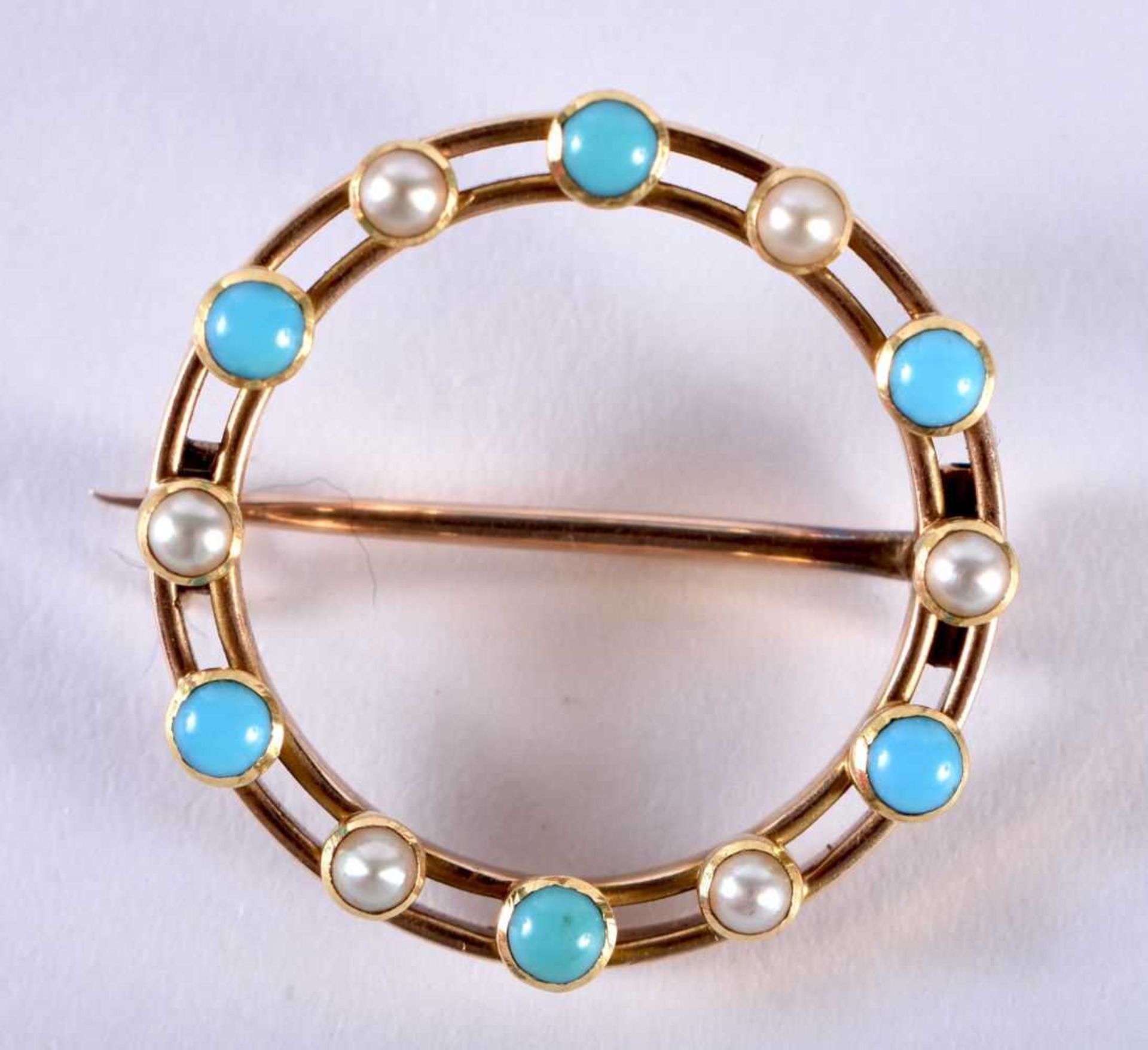 A VICTORIAN YELLOW METAL TURQUOISE AND PEARL BROOCH. 3.7 grams. 2.25 cm diameter.