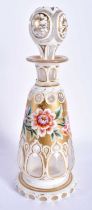 A 19TH CENTURY BOHEMIAN GLASS SCENT BOTTLE AND STOPPER overlaid with white enamel and gilt panels,
