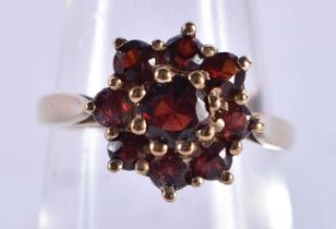 A 9 Ct Gold ring set with 9 Garnets. Size M, weight 2.82g