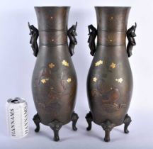 A LARGE PAIR OF 19TH CENTURY JAPANESE MEIJI PERIOD BRONZE BIRD VASES decorated in relief amongst