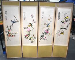 AN EARLY 20TH CENTURY CHINESE SILK EMBROIDERED BIRD SCREEN. 60 cm x 180 cm.