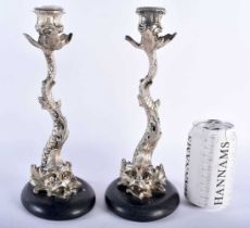 A LARGE PAIR OF 19TH CENTURY SILVER PLATED MYTHICAL DOLPHIN FISH CANDLESTICKS in the manner of
