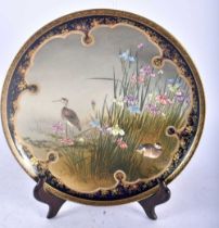 A 19TH CENTURY JAPANESE MEIJI PERIOD SATSUMA POTTERY DISH by Kinkozan, painted with a pair of