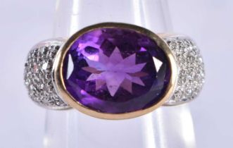 An 9 Ct Gold Ring set with an Amethyst with diamond shoulder. Size M, weight 5.61g