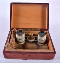 A BOXED PAIR OF MOTHER OF PEARL INLAID OPERA GLASSES. 8.5cm x 4.3cm extended.