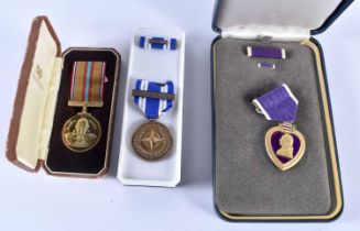 A Cased North Atlantic Treaty Organization Non-Article 5 NATO medal for personnel participating in