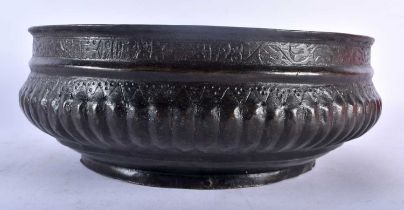 AN EARLY 18TH CENTURY CONTINENTAL BRONZE ISLAMIC STYLE BASIN C1728 of circular form, the base with