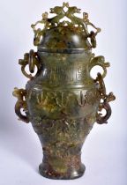 A 19TH CENTURY CHINESE CARVED MUTTON JADE VASE AND COVER Qing, overlaid with opposing dragons.