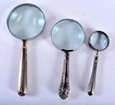 Three Silver Handled Magnifying Glasses. Hallmarks incl Sheffield 1916 and London 1891. Largest 21.