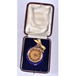 AN ANTIQUE GOLD FOB WATCH with attached rolled gold pendant. 38.4 grams overall. 3.5 cm diameter.
