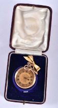 AN ANTIQUE GOLD FOB WATCH with attached rolled gold pendant. 38.4 grams overall. 3.5 cm diameter.