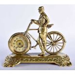 A RARE EDWARDIAN NOVELTY CYCLING CLOCK formed as a male standing upon a rectangular base. 18 cm x