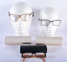 Two Cased Jimmy Choo Spectacles together with a Cased Pair of Prada Glasses. (3)