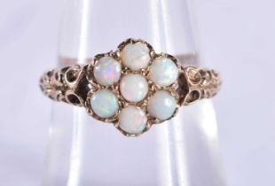 A 9 Ct Gold ring set with 7 Opals. Size O. weight 2.52g