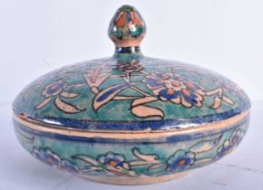 AN EARLY 20TH CENTURY MIDDLE EASTERN PALESTINIAN WARE BOWL AND COVER painted with flowers in the