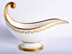 A LATE 19TH CENTURY FRENCH SEVRES PORCELAIN SAUCEBOAT of elegant form, painted with delicate acorn