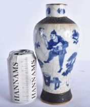 A 19TH CENTURY CHINESE CRACKLE GLAZED BLUE AND WHITE VASE Qing. 22.5 cm high.