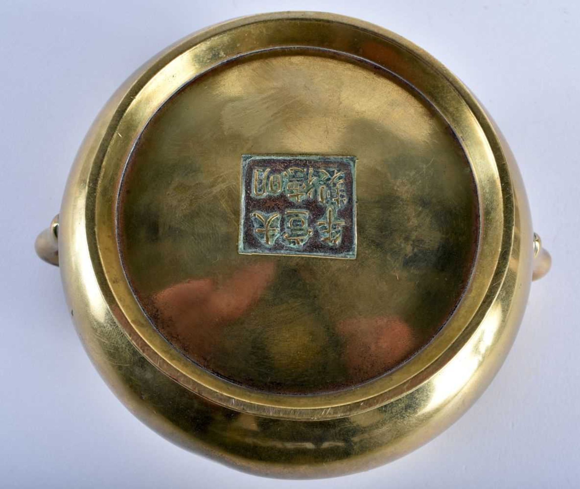 AN 18TH CENTURY CHINESE TWIN HANDLED BRONZE CENSER bearing Xuande marks to base, of plain form. - Image 9 of 16