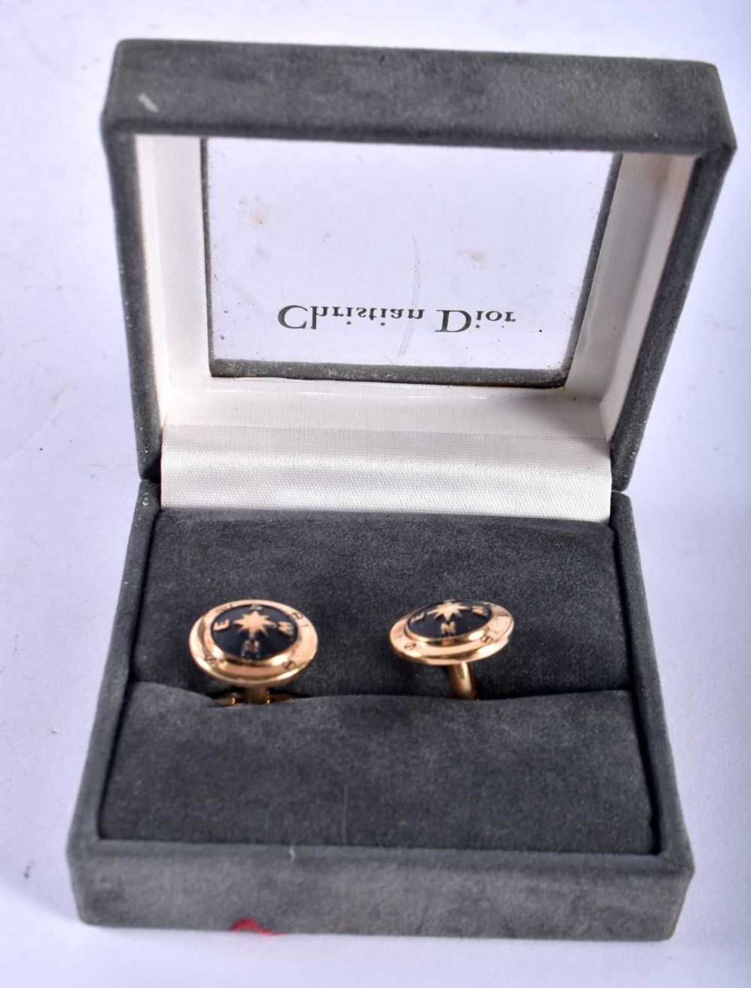 A pair of gold tone enamel cufflinks by Christian Dior (15g)