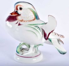 AN UNUSUAL LARGE MEISSEN PORCELAIN FIGURE OF A BIRD modelled with brightly painted enamels, standing